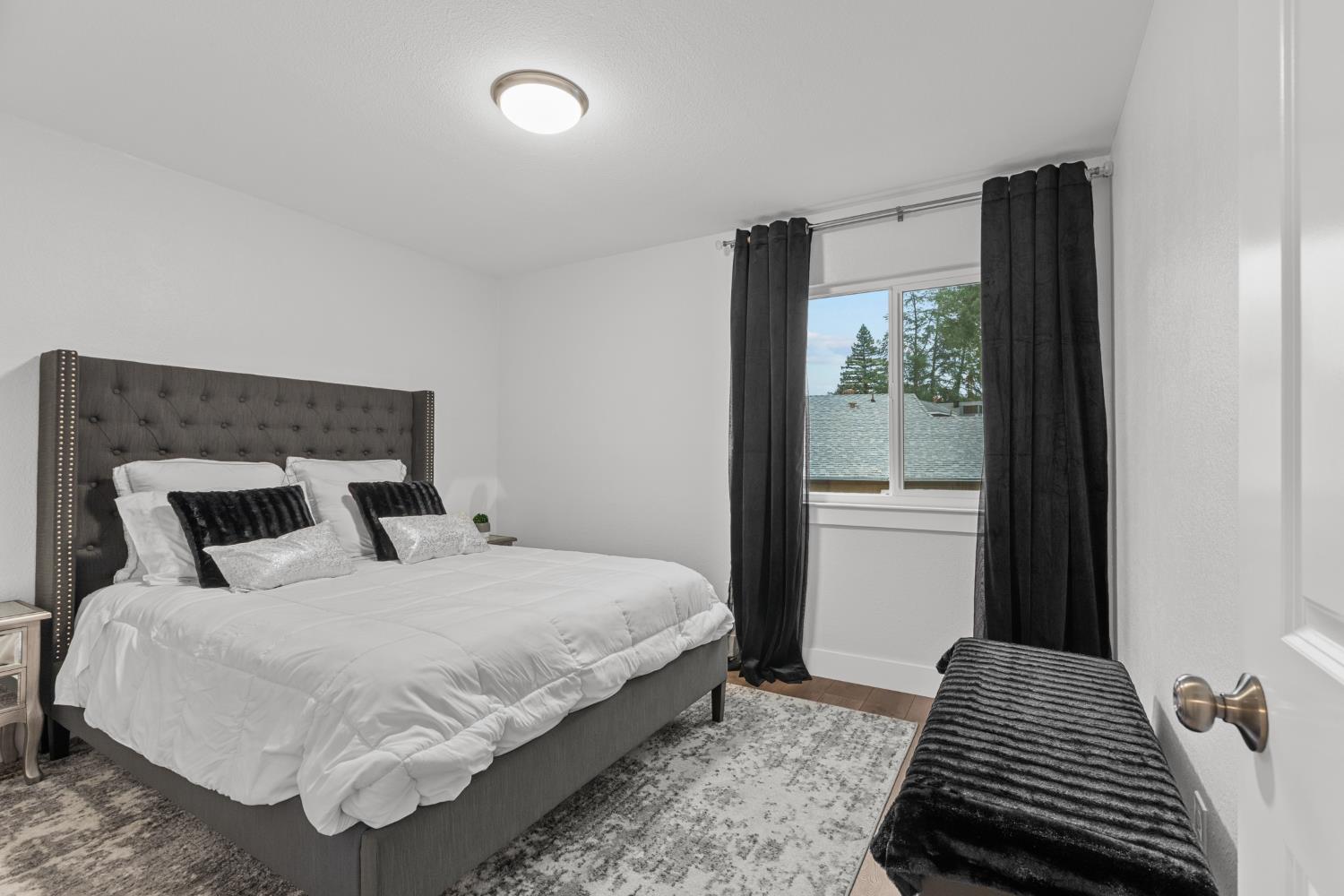 7135 Mathis Court Citrus Heights, CA 95610 - Photo 26 of 39 a bedroom with a bed and wooden floor