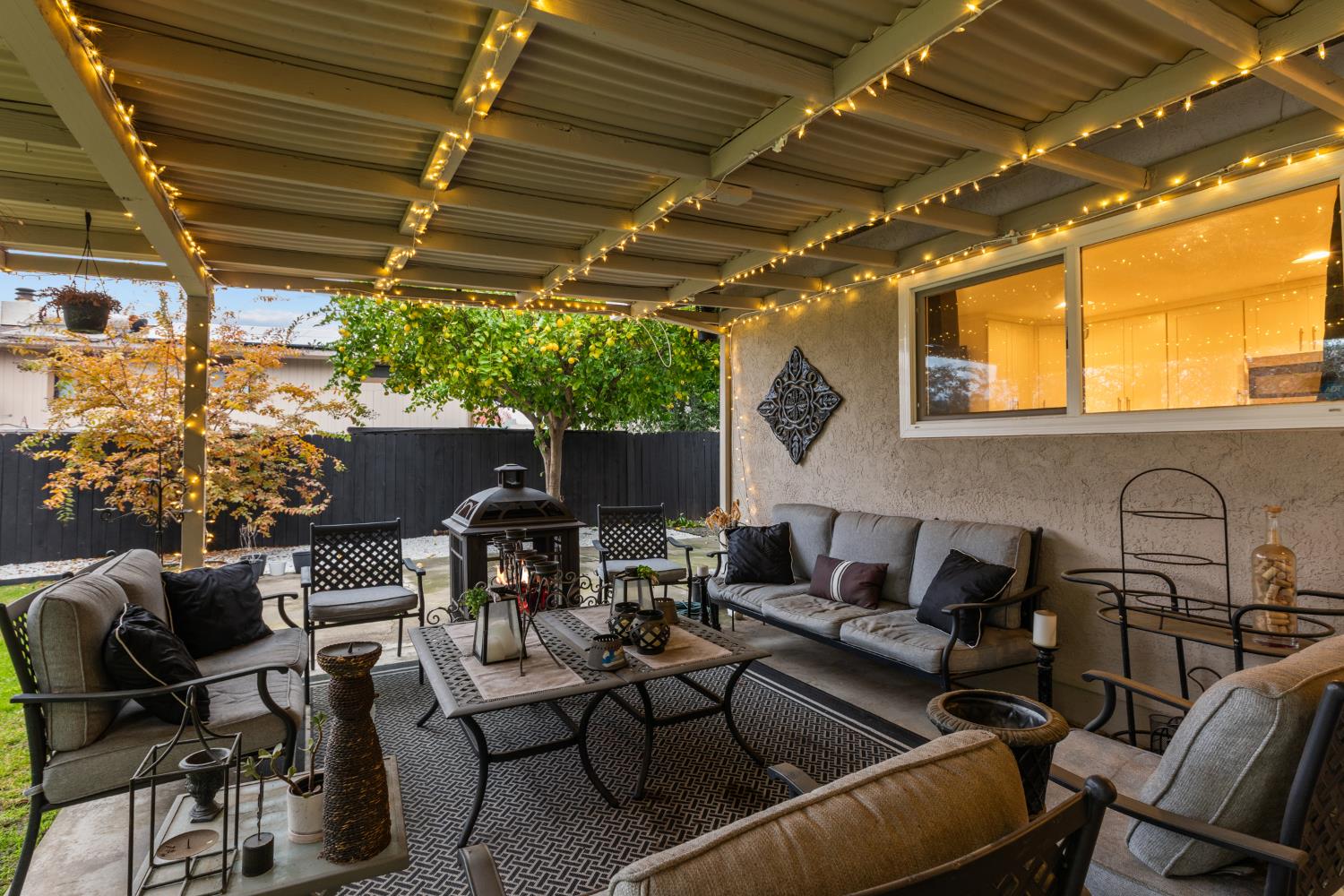 7135 Mathis Court Citrus Heights, CA 95610 - Photo 32 of 39 a outdoor living space with furniture and a black umbrella