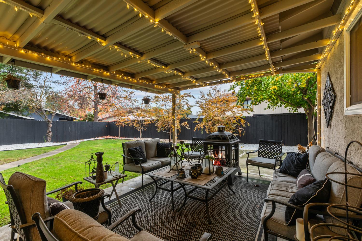 7135 Mathis Court Citrus Heights, CA 95610 - Photo 33 of 39 a view of a chairs and table in patio with a small yard