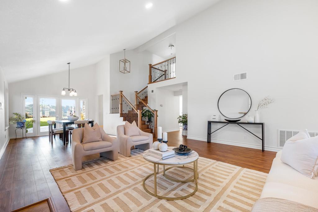1592 Hawk View Drive Encinitas, CA 92024 - Photo 1 of 55 a living room with couches a rug and a chandelier