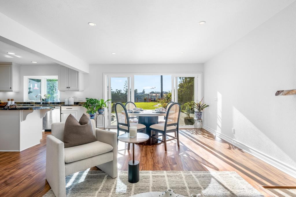 1592 Hawk View Drive Encinitas, CA 92024 - Photo 12 of 55 a living room with furniture a dining table and a potted plant