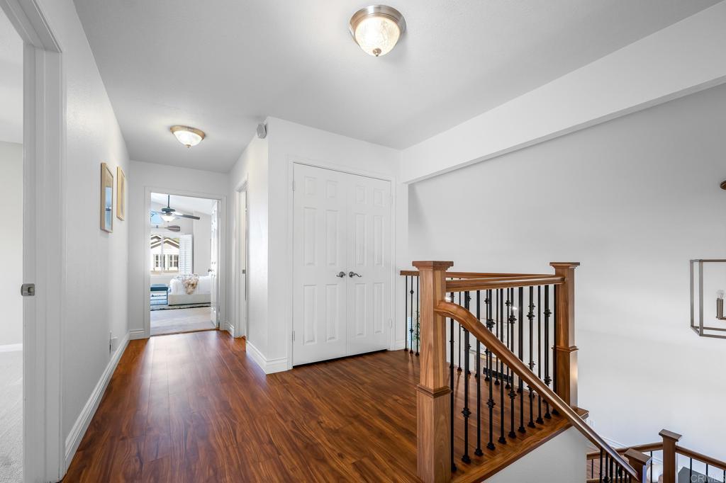 1592 Hawk View Drive Encinitas, CA 92024 - Photo 13 of 55 a view of a hallway with wooden floor and entryway
