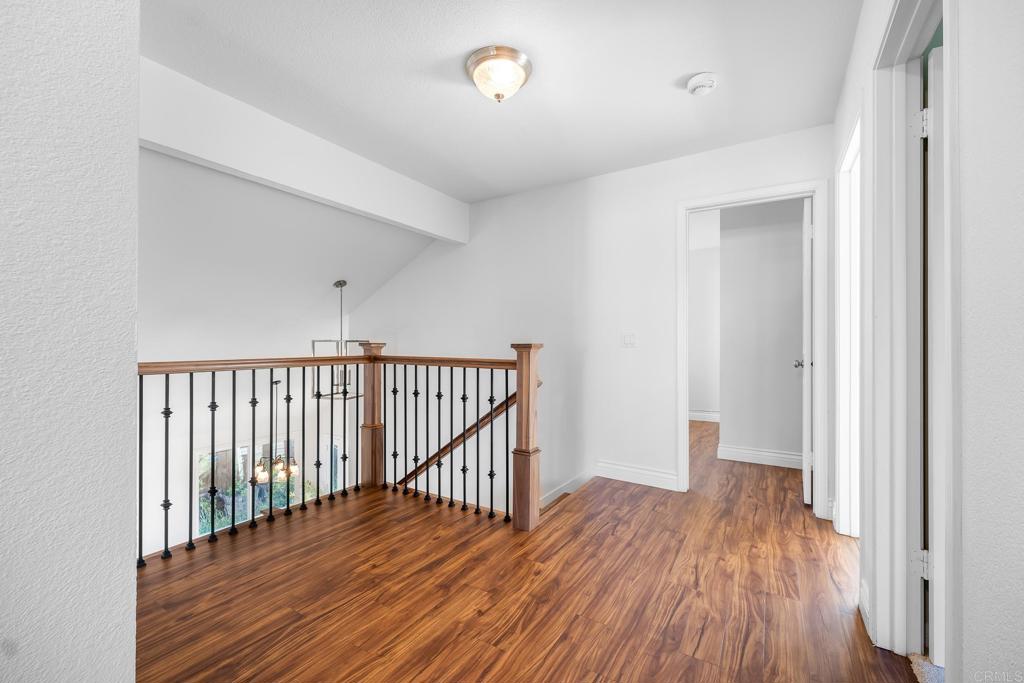 1592 Hawk View Drive Encinitas, CA 92024 - Photo 14 of 55 a view of a hallway with wooden floor