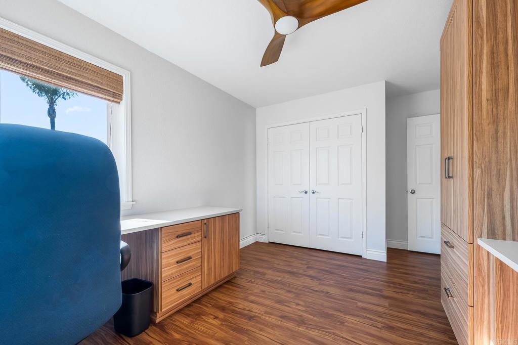 1592 Hawk View Drive Encinitas, CA 92024 - Photo 16 of 55 a view of a hallway with wooden floor and cabinet