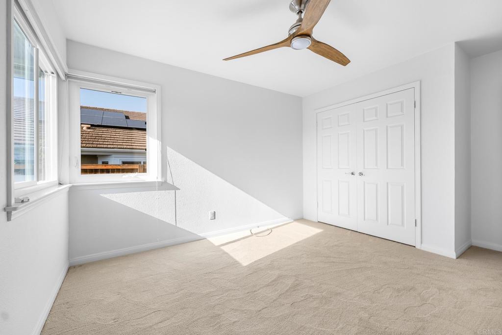 1592 Hawk View Drive Encinitas, CA 92024 - Photo 18 of 55 an empty room with windows and cabinet