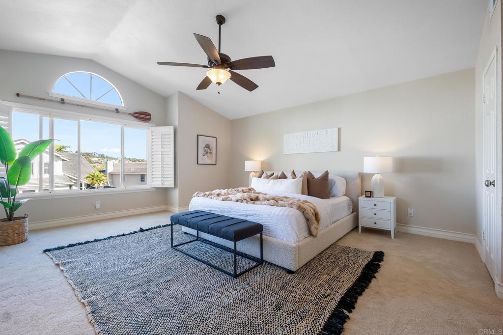 1592 Hawk View Drive Encinitas, CA 92024 - Photo 22 of 55 a spacious bedroom with a bed and ceiling fan