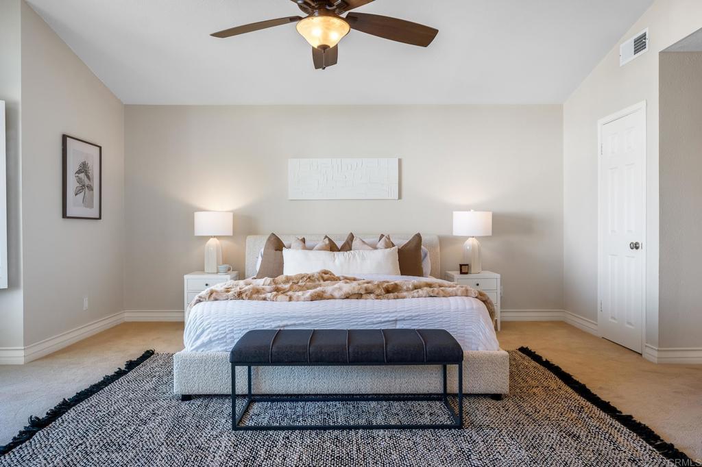 1592 Hawk View Drive Encinitas, CA 92024 - Photo 23 of 55 a bedroom with a bed and a lamp