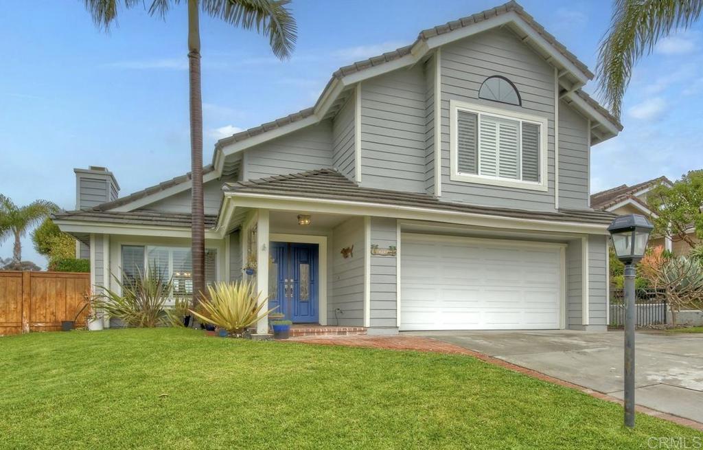 1592 Hawk View Drive Encinitas, CA 92024 - Photo 40 of 55 a view of a white house with a small yard and a large window