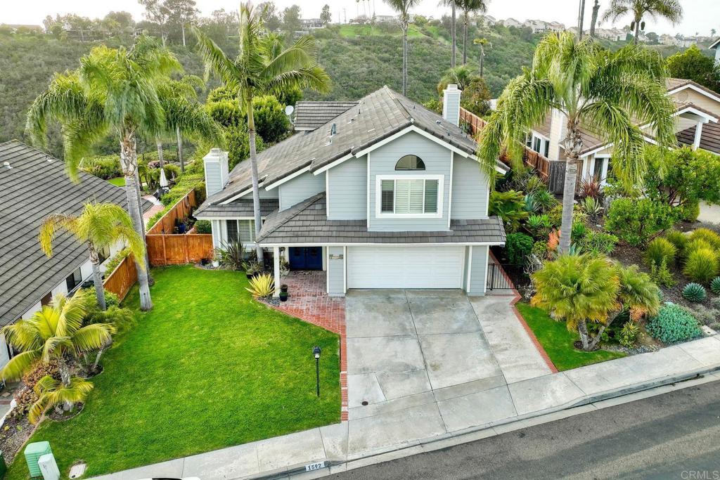 1592 Hawk View Drive Encinitas, CA 92024 - Photo 42 of 55 a front view of a house with a garden