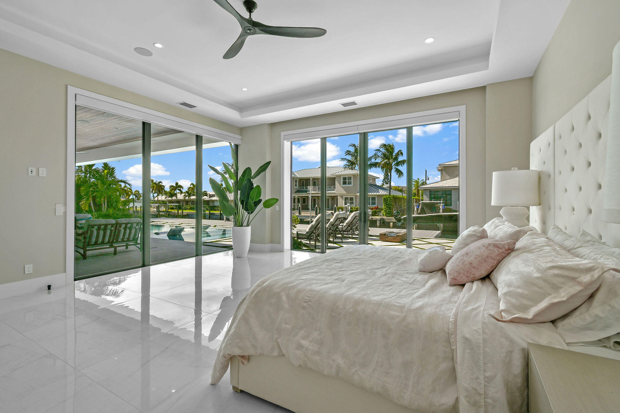 1060 Fairview Lane Singer Island, FL 33404 - Photo 23 of 82 a bedroom with a large bed and a large window