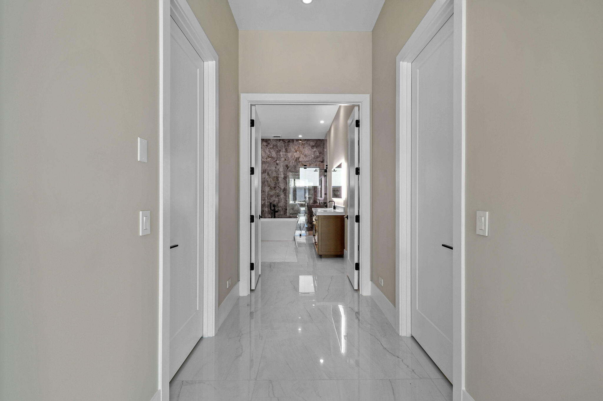 1060 Fairview Lane Singer Island, FL 33404 - Photo 25 of 82 a view of a hallway with a livingroom and a bathroom with sink