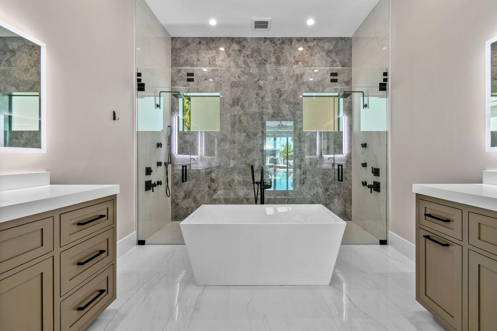 1060 Fairview Lane Singer Island, FL 33404 - Photo 27 of 82 a spacious bathroom with a tub sink and mirror