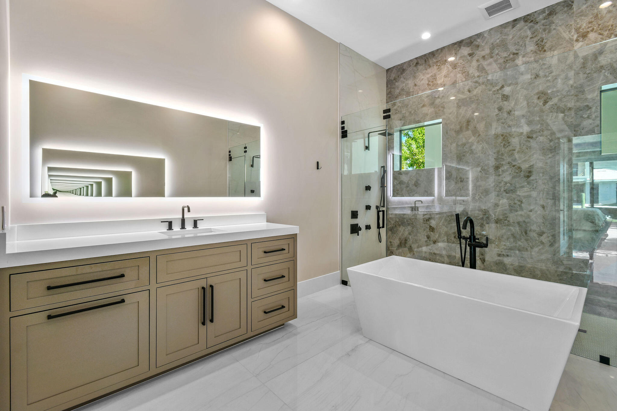 1060 Fairview Lane Singer Island, FL 33404 - Photo 28 of 82 a bathroom with a tub sink and mirror