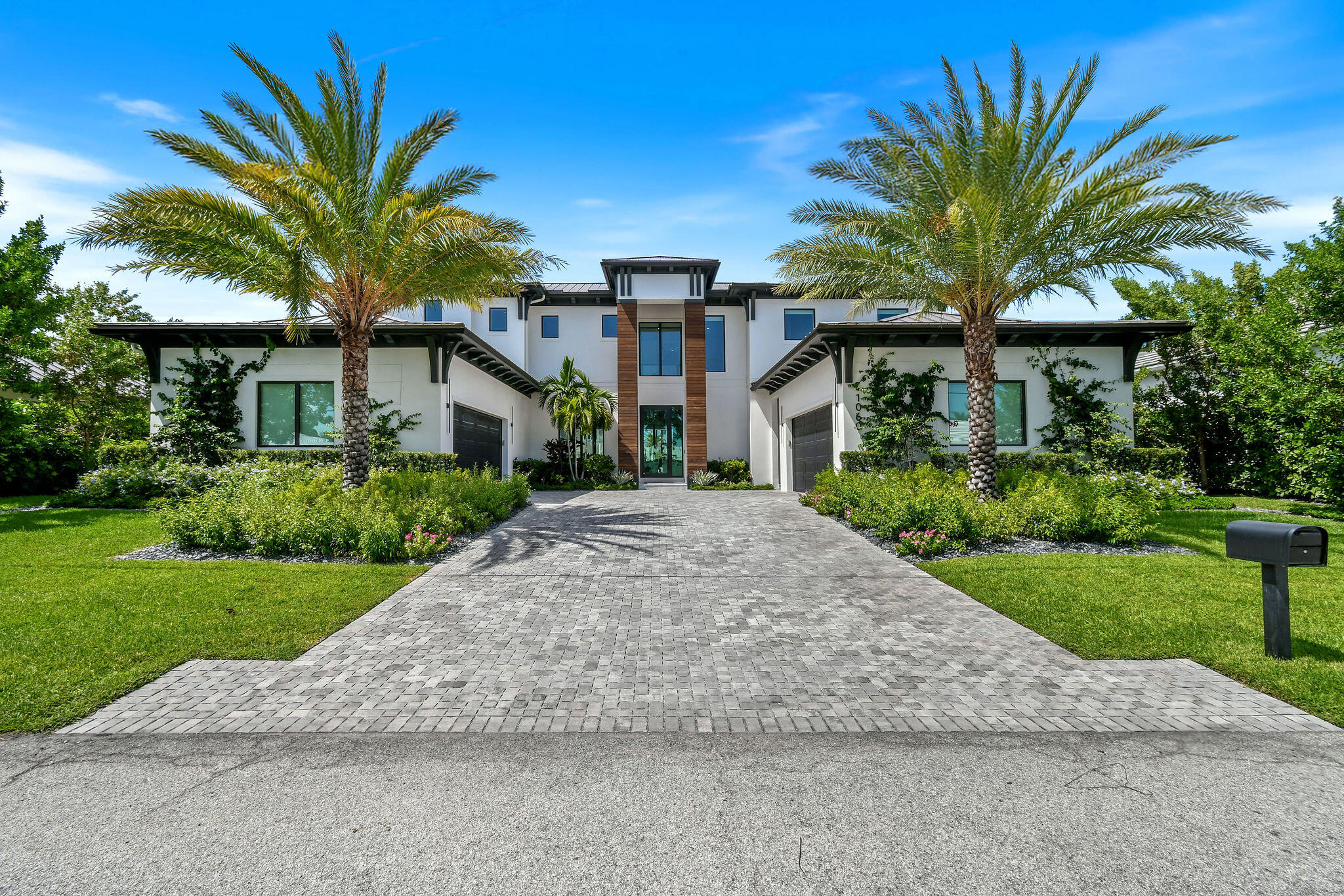 1060 Fairview Lane Singer Island, FL 33404 - Photo 3 of 82 a front view of a house with a garden