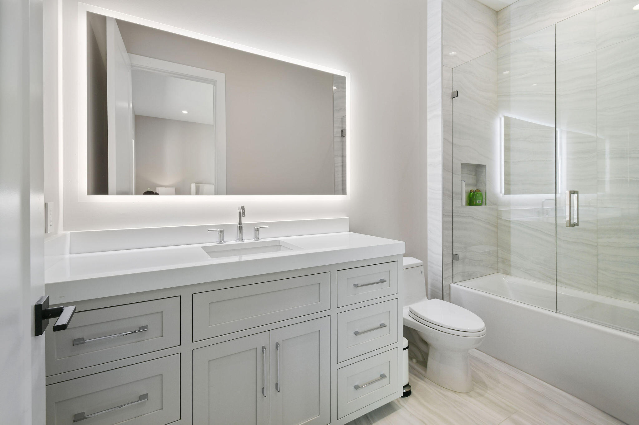 1060 Fairview Lane Singer Island, FL 33404 - Photo 55 of 82 a bathroom with a sink a toilet and shower