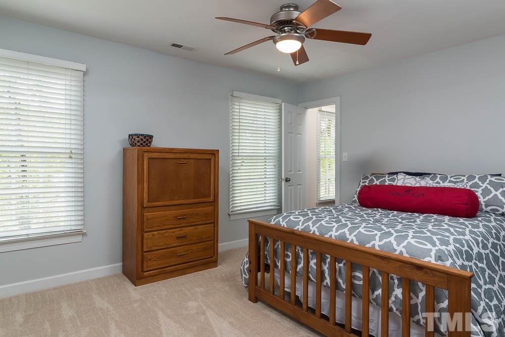 2908 Sunnystone Way Raleigh, NC 27613 - Photo 14 of 25 a bedroom with a bed and a closet