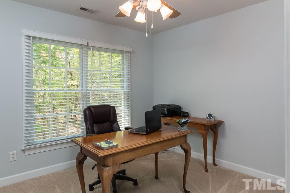 2908 Sunnystone Way Raleigh, NC 27613 - Photo 16 of 25 a view of a workspace with a window