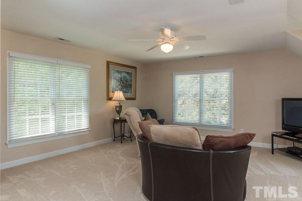 2908 Sunnystone Way Raleigh, NC 27613 - Photo 18 of 25 a living room with furniture and a window