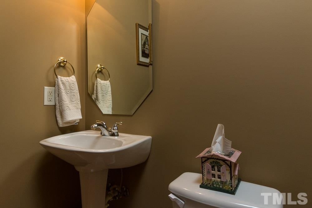 2908 Sunnystone Way Raleigh, NC 27613 - Photo 20 of 25 a bathroom with a sink and mirror