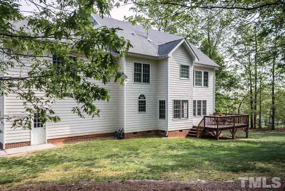 2908 Sunnystone Way Raleigh, NC 27613 - Photo 21 of 25 a front view of a house with a yard