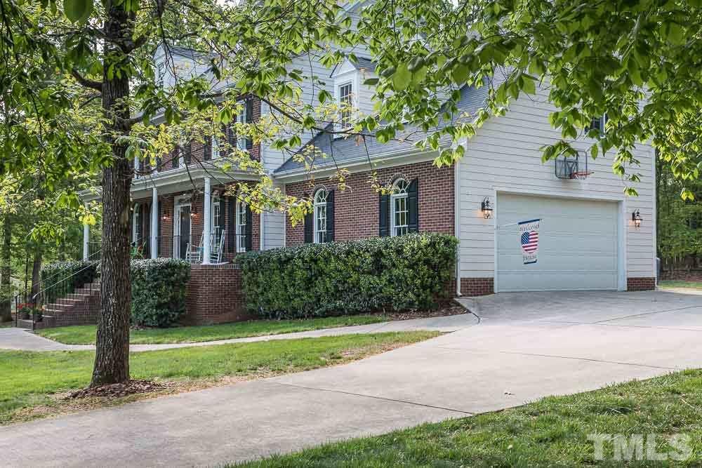 2908 Sunnystone Way Raleigh, NC 27613 - Photo 25 of 25 a front view of house with yard and green space