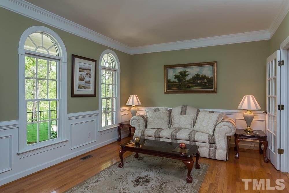 2908 Sunnystone Way Raleigh, NC 27613 - Photo 4 of 25 a living room with furniture and a window