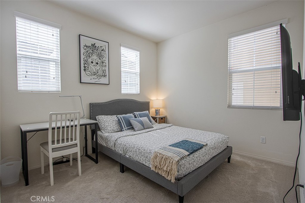 1509 Granada Road Upland, CA 91786 - Photo 12 of 31 a bedroom with a bed lamp and a window