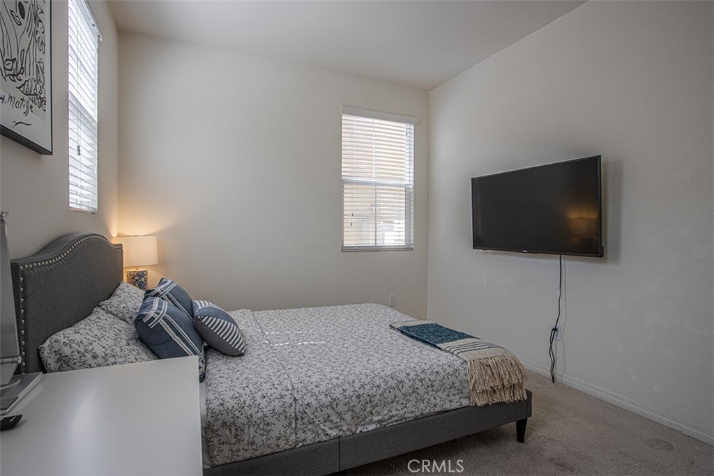 1509 Granada Road Upland, CA 91786 - Photo 13 of 31 a bedroom with a bed and a flat screen tv