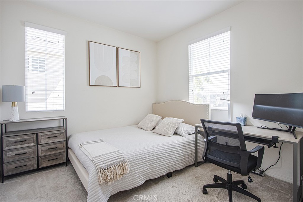 1509 Granada Road Upland, CA 91786 - Photo 14 of 31 a bedroom with a bed a dresser and a window