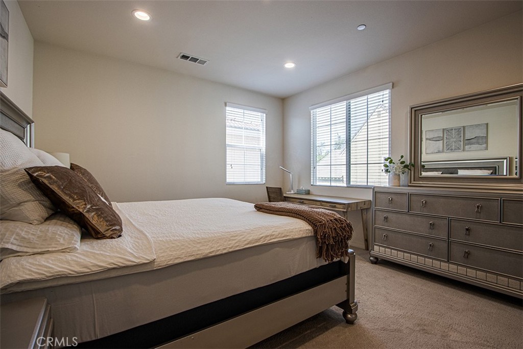 1509 Granada Road Upland, CA 91786 - Photo 16 of 31 a bedroom with a bed and a dresser