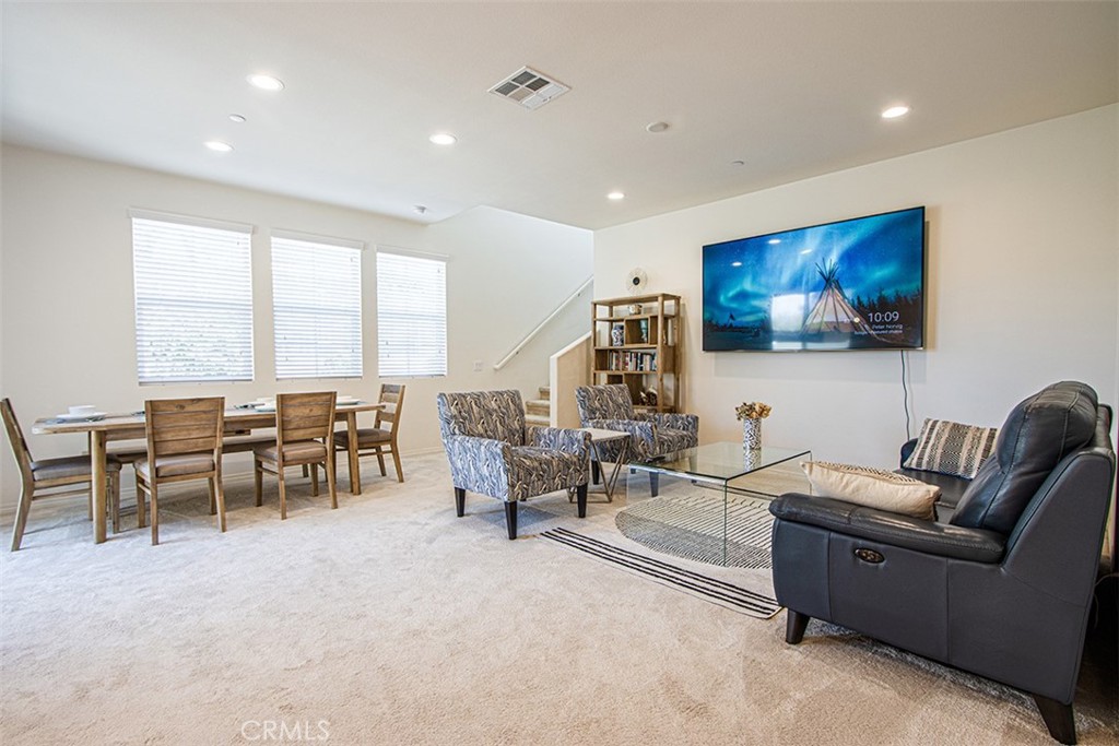 1509 Granada Road Upland, CA 91786 - Photo 2 of 31 a living room with furniture and a flat screen tv