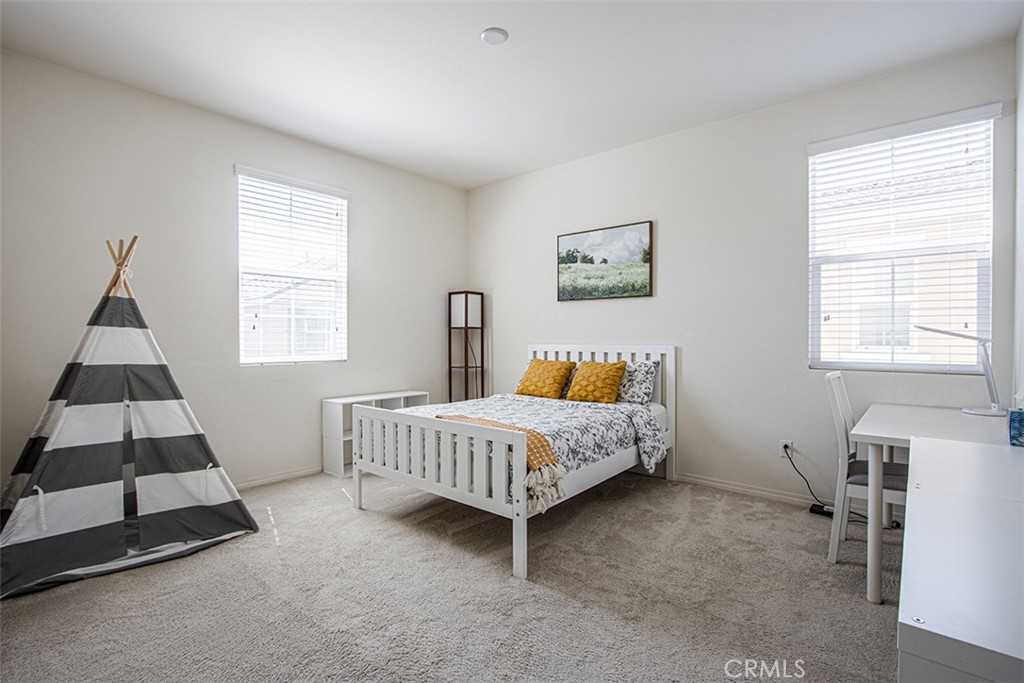 1509 Granada Road Upland, CA 91786 - Photo 10 of 31 a bed room with a bed and a window