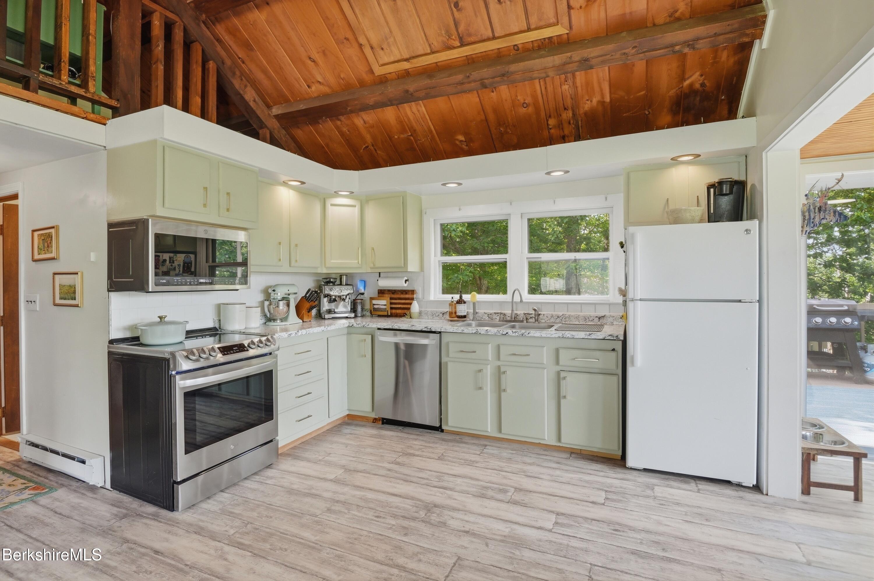 4 David Drive Peru, MA 01235 - Photo 15 of 44 a kitchen with a sink cabinets stainless steel appliances and wooden floor