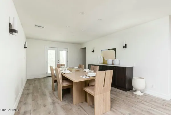 a large bathroom with a granite countertop double vanity