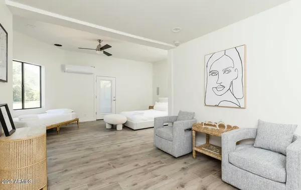 a view of a house with swimming pool and sitting area