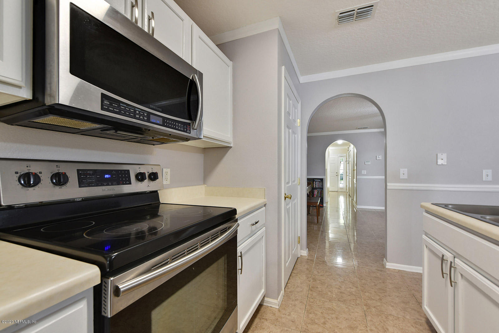 10543 Autumn Trace Road Jacksonville, FL 32257 - Photo 14 of 25 a stove top oven sitting inside of a kitchen