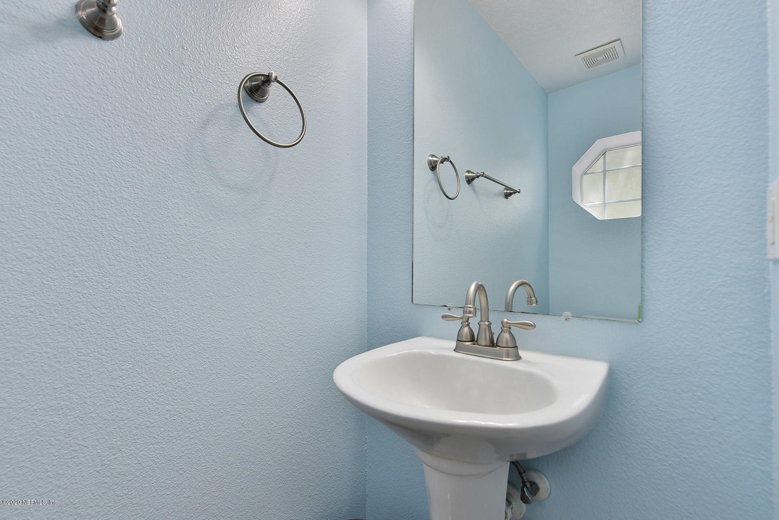 10543 Autumn Trace Road Jacksonville, FL 32257 - Photo 15 of 25 a bathroom with a sink a mirror and shower