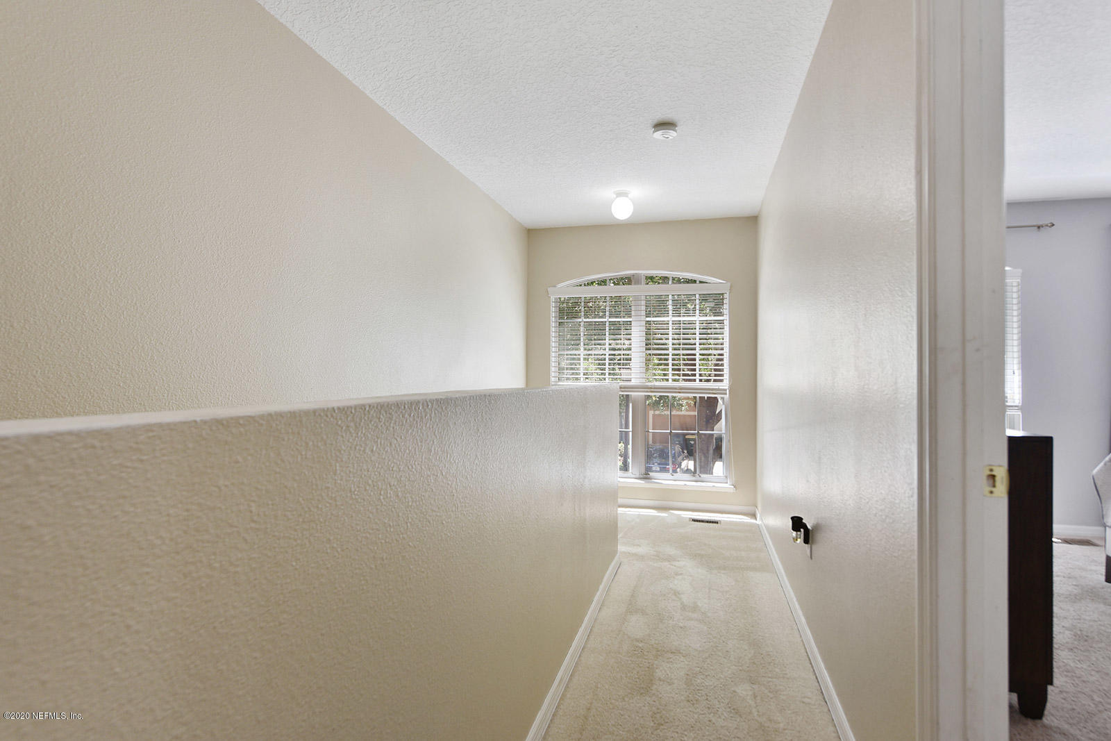 10543 Autumn Trace Road Jacksonville, FL 32257 - Photo 16 of 25 wooden floor in an empty room with a window