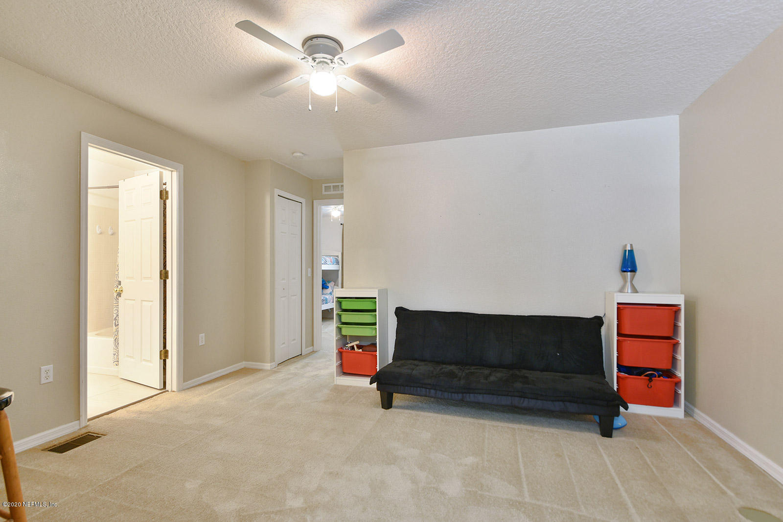 10543 Autumn Trace Road Jacksonville, FL 32257 - Photo 17 of 25 a living room with furniture and a ceiling fan
