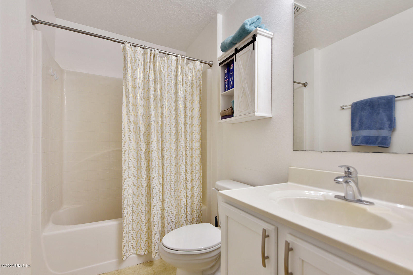 10543 Autumn Trace Road Jacksonville, FL 32257 - Photo 19 of 25 a bathroom with a sink toilet and shower