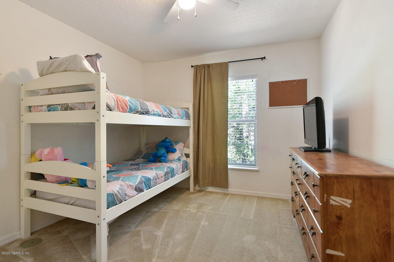 10543 Autumn Trace Road Jacksonville, FL 32257 - Photo 22 of 25 a bedroom with a bed and a window