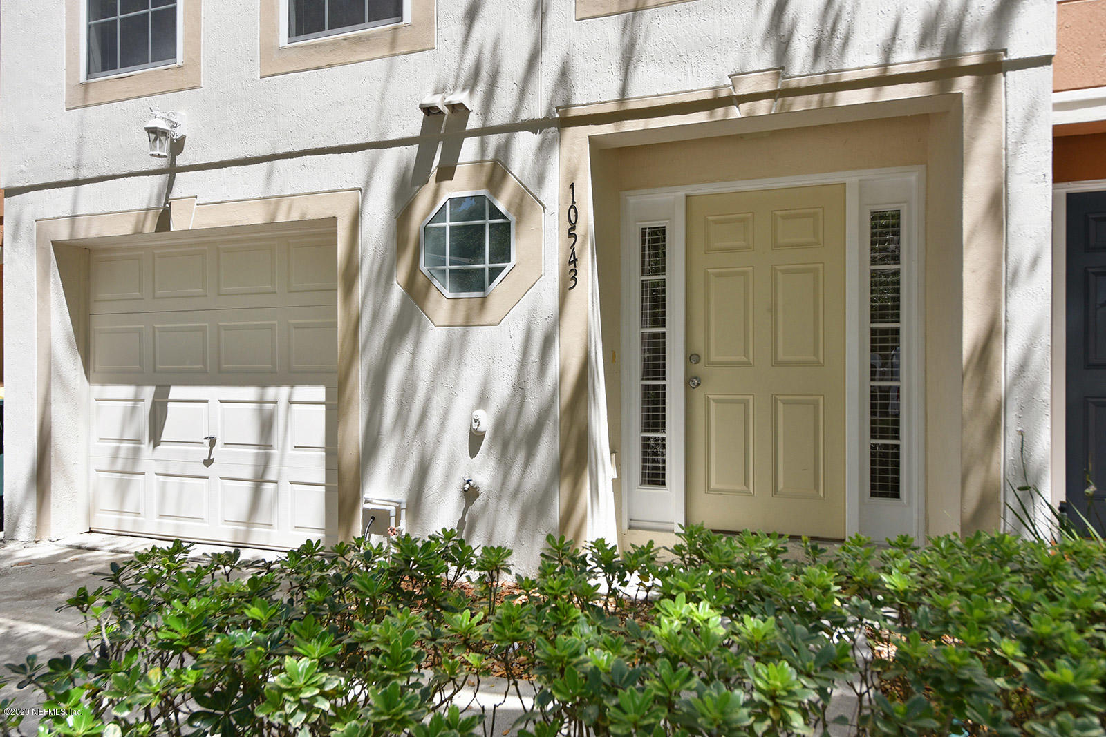 10543 Autumn Trace Road Jacksonville, FL 32257 - Photo 3 of 25 a view of a house with a potted plant and a window