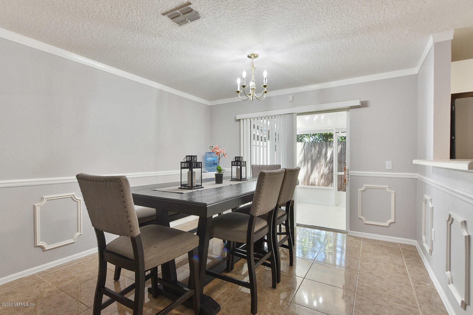 10543 Autumn Trace Road Jacksonville, FL 32257 - Photo 9 of 25 a view of a dining room with furniture and window