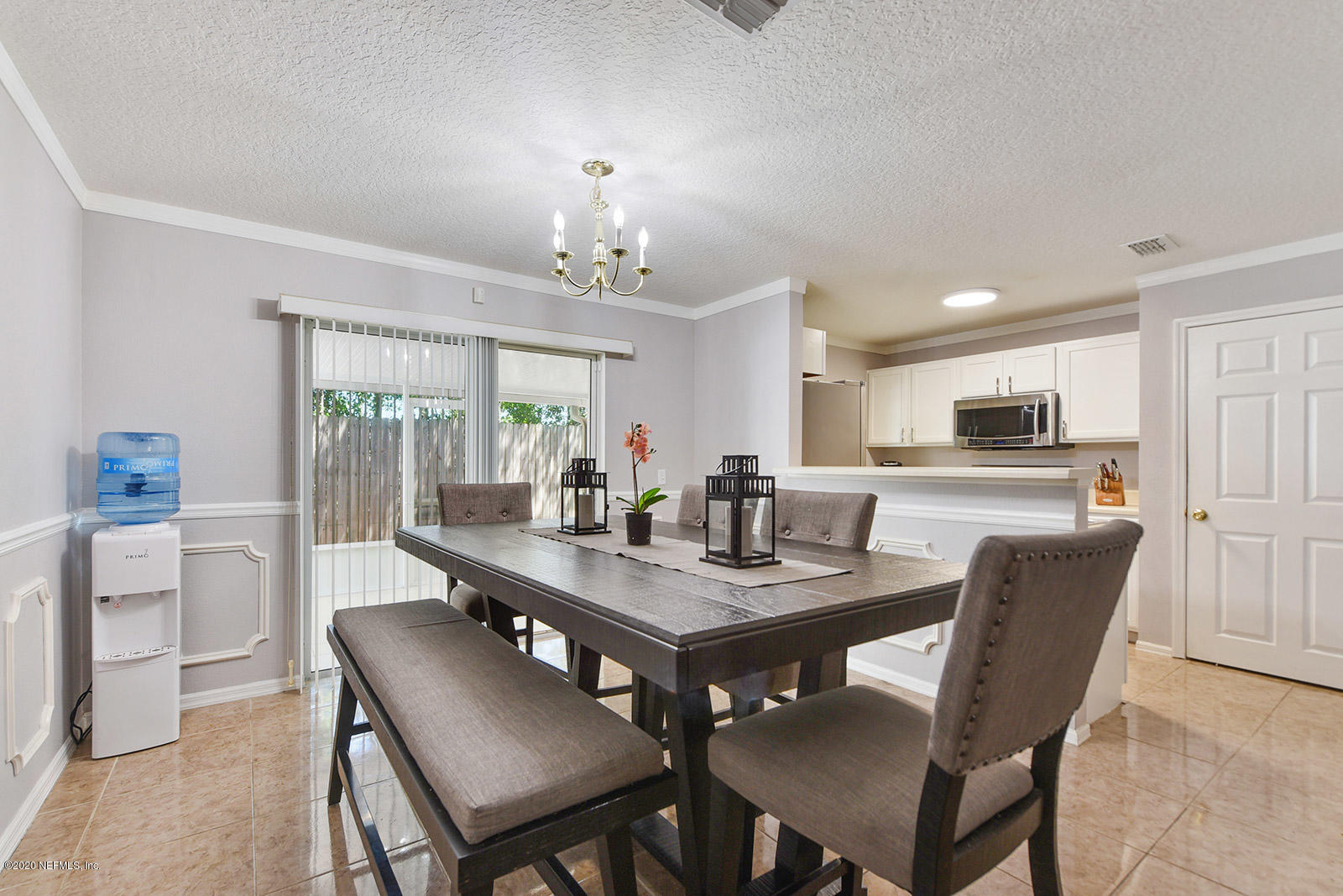 10543 Autumn Trace Road Jacksonville, FL 32257 - Photo 10 of 25 a view of a dining room with furniture and a chandelier