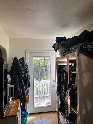a view of a livingroom with furniture and window