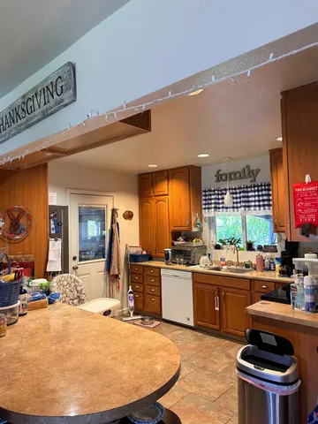 a kitchen with a stove a sink and a refrigerator