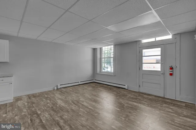 a view of an empty room with a window