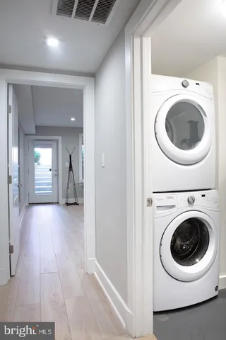 a view of a hallway with washer and dryer