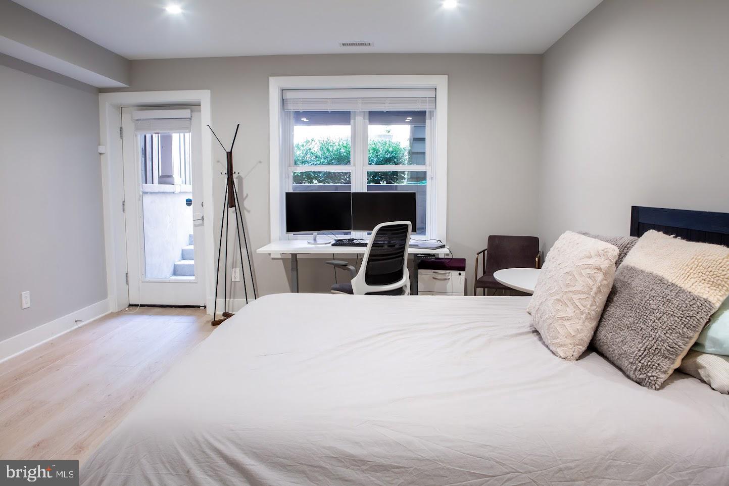 720 East Capitol Street Northeast Washington, DC 20003 - Photo 10 of 12 a bedroom with a bed and a large window