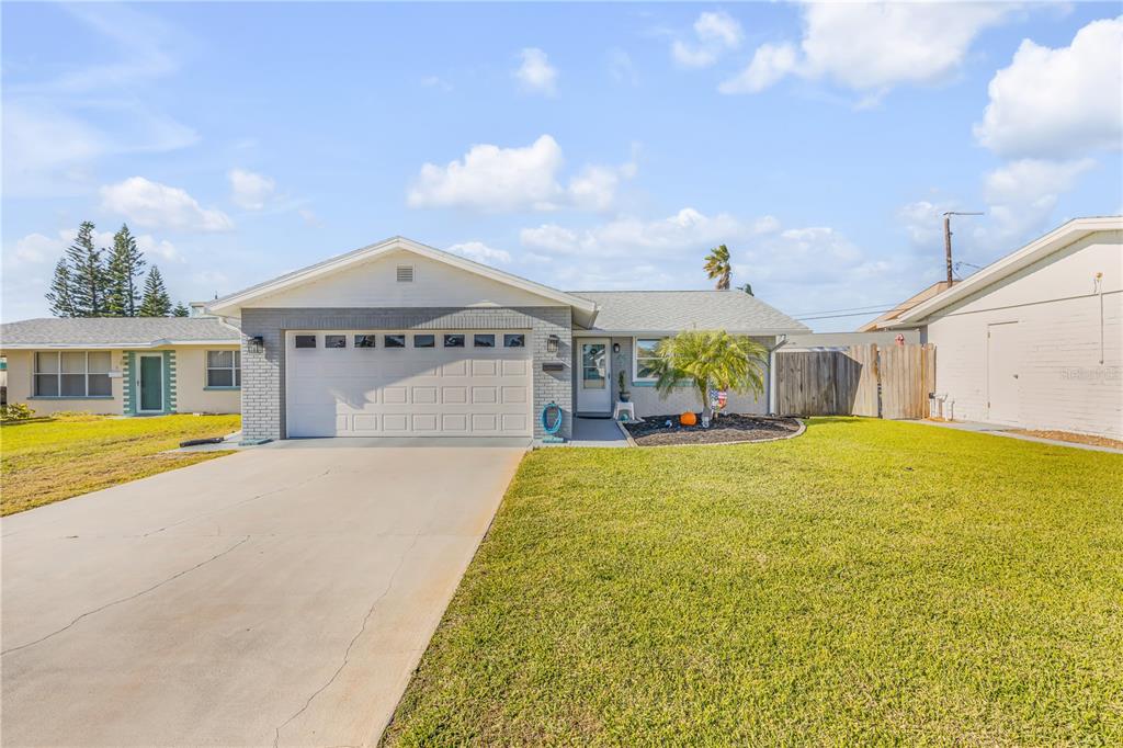 a swimming pool with yard and balcony in the back